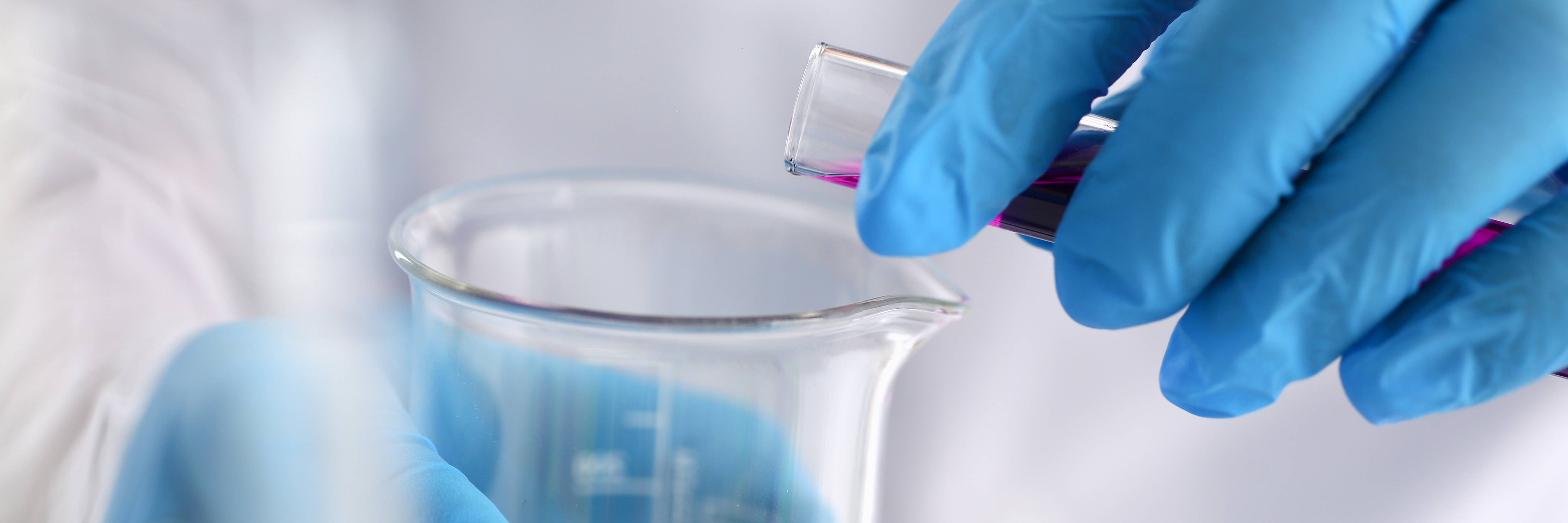 photo of chemist mixing chemicals in a lab